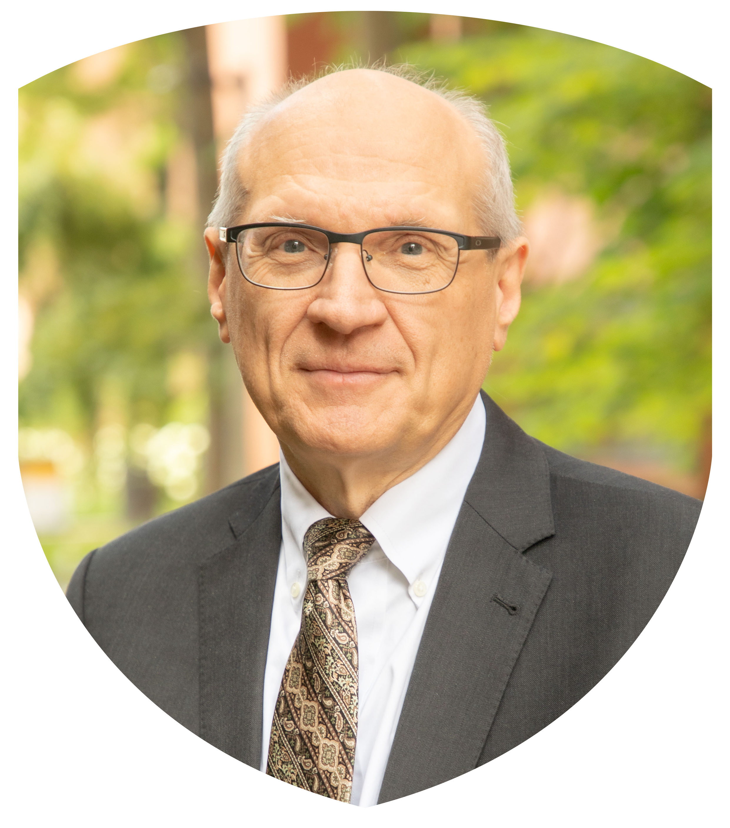 man in gray suit wearing glasses